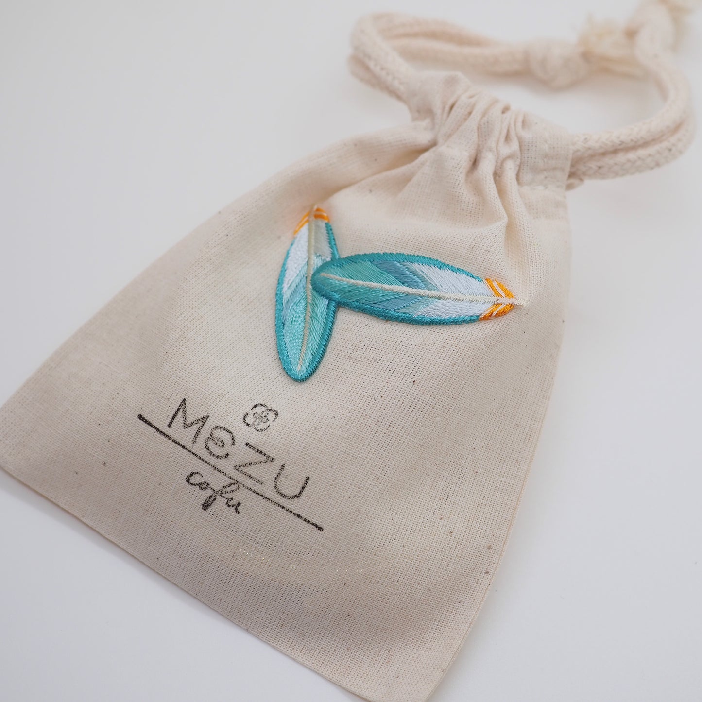 Compact Mirror with Embroidered Drawstring Pouch - Taka Feather