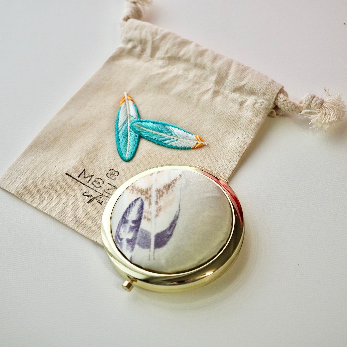 Compact Mirror with Embroidered Drawstring Pouch - Taka Feather
